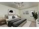 Cozy bedroom with neutral tones, shuttered windows, and decorative wall art at 131 N Higley Rd # 117, Mesa, AZ 85205