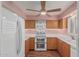Charming kitchen with wood cabinets, stainless steel appliances, and stylish backsplash at 131 N Higley Rd # 117, Mesa, AZ 85205