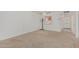 Inviting living room showcases neutral carpeting, passthrough to kitchen, and ample space at 131 N Higley Rd # 117, Mesa, AZ 85205