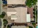 Aerial view of the property showcasing the backyard, landscaping, and roof at 13857 W Windsor Ave, Goodyear, AZ 85395