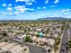 Expansive aerial view shows a well-planned community with tree-lined streets, meticulously kept landscaping, and convenient access to nearby amenities at 13857 W Windsor Ave, Goodyear, AZ 85395