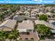 Beautiful aerial view of a well-maintained home with mature landscaping and a circular driveway in a desirable neighborhood at 13857 W Windsor Ave, Goodyear, AZ 85395