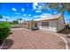 Backyard with decorative rock, covered patio and block wall at 13857 W Windsor Ave, Goodyear, AZ 85395