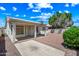 Covered patio area with desert landscaping and privacy fence at 13857 W Windsor Ave, Goodyear, AZ 85395