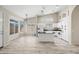 Beautiful kitchen with white cabinets, black countertops, an island, and stainless steel appliances at 13857 W Windsor Ave, Goodyear, AZ 85395