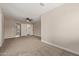 A bedroom featuring a ceiling fan and double door closet at 1416 W Highland St, Chandler, AZ 85224