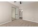 Bedroom featuring mirrored closet doors and neutral carpet at 1416 W Highland St, Chandler, AZ 85224