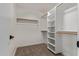 Walk-in closet with built-in shelving and ample storage space at 1416 W Highland St, Chandler, AZ 85224