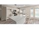 Modern kitchen with white cabinets, stainless steel appliances, and a large center island at 1416 W Highland St, Chandler, AZ 85224