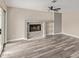 Inviting living room featuring a stone fireplace, built-in shelving, and sliding glass doors at 1416 W Highland St, Chandler, AZ 85224