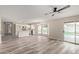 Bright, open floor plan with modern flooring, seamlessly connecting living and kitchen areas, plus a pool view at 1416 W Highland St, Chandler, AZ 85224
