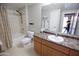 Well-lit bathroom with shower over tub, neutral wall color, and sleek vanity at 14250 W Wigwam Blvd # 522, Litchfield Park, AZ 85340