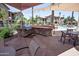 Outdoor kitchen and BBQ area with a grill and dining area, perfect for community gatherings at 14250 W Wigwam Blvd # 522, Litchfield Park, AZ 85340