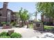 Community outdoor grilling area nestled within lush landscaping at 14250 W Wigwam Blvd # 522, Litchfield Park, AZ 85340