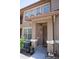 Charming townhome front door, AC, and outdoor plants at 14250 W Wigwam Blvd # 522, Litchfield Park, AZ 85340