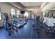 Modern gym equipped with treadmills, ellipticals, weights, and other exercise machines at 14250 W Wigwam Blvd # 522, Litchfield Park, AZ 85340