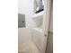 Compact laundry space includes a dryer and overhead storage at 14250 W Wigwam Blvd # 522, Litchfield Park, AZ 85340