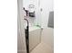 Convenient laundry room featuring a washing machine and storage shelves at 14250 W Wigwam Blvd # 522, Litchfield Park, AZ 85340