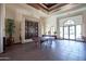 Bright lobby featuring a pool table, beautiful tile flooring, and plenty of natural light at 14250 W Wigwam Blvd # 522, Litchfield Park, AZ 85340