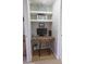 Cozy office nook with built-in desk, shelving, and neutral wall color. Perfect for work from home at 14250 W Wigwam Blvd # 522, Litchfield Park, AZ 85340