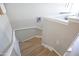 View of a staircase with neutral walls, light wood steps, white risers and handrail, and natural light at 14250 W Wigwam Blvd # 522, Litchfield Park, AZ 85340