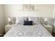 Bedroom with patterned bedding, white nightstands and stylish glass lamps at 1469 S Boulder St # C, Gilbert, AZ 85296