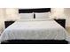 Comfortable bedroom with patterned bedding, bedside lamps and dark wood furniture at 1469 S Boulder St # C, Gilbert, AZ 85296