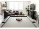 Game room featuring a pool table, comfortable seating, and modern decor for a relaxing atmosphere at 1469 S Boulder St # C, Gilbert, AZ 85296