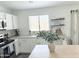 Contemporary kitchen boasting stainless steel appliances, white cabinets, and a view of the sink area at 1469 S Boulder St # C, Gilbert, AZ 85296