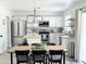 Bright kitchen boasts stainless steel appliances, white cabinetry, and a stylish island with light wood counter at 1469 S Boulder St # C, Gilbert, AZ 85296
