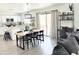 Open-concept living area with a modern kitchen, dining space, and sliding glass doors for indoor-outdoor living at 1469 S Boulder St # C, Gilbert, AZ 85296