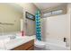 Standard bathroom with a single sink vanity, toilet and tub with shower at 1564 E Leaf Rd, San Tan Valley, AZ 85140