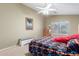 Inviting bedroom featuring a neutral color palette and a large window at 1564 E Leaf Rd, San Tan Valley, AZ 85140