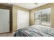 Bedroom with natural lighting and a closet with sliding doors at 1564 E Leaf Rd, San Tan Valley, AZ 85140
