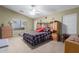 Comfortable bedroom with natural light, a ceiling fan, and ample closet space at 1564 E Leaf Rd, San Tan Valley, AZ 85140