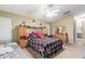 Bright bedroom with a ceiling fan and matching furniture sets at 1564 E Leaf Rd, San Tan Valley, AZ 85140