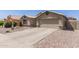 Charming single-Gathering home with desert landscaping and a two-car garage at 1564 E Leaf Rd, San Tan Valley, AZ 85140