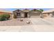 Charming single-Gathering home with desert landscaping and a two-car garage at 1564 E Leaf Rd, San Tan Valley, AZ 85140