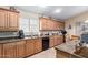 Well-equipped kitchen with ample counter space, wooden cabinets, and modern appliances at 1564 E Leaf Rd, San Tan Valley, AZ 85140