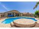Backyard oasis featuring a pool with a tanning deck at 1564 E Leaf Rd, San Tan Valley, AZ 85140
