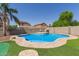 Backyard pool with attached spa and lush landscaping at 1564 E Leaf Rd, San Tan Valley, AZ 85140