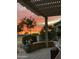 Relax on this back patio with a pergola, desert landscaping, and views of the stunning Arizona sunset at 16077 W Vale Dr, Goodyear, AZ 85395