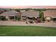 A charming backyard with a covered patio, desert landscaping, and sunset views is perfect for outdoor relaxation at 16077 W Vale Dr, Goodyear, AZ 85395