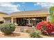 Stunning backyard with lush landscaping and a covered patio for relaxation at 16077 W Vale Dr, Goodyear, AZ 85395