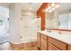 Modern bathroom boasts a glass enclosed shower and a double sink vanity at 16077 W Vale Dr, Goodyear, AZ 85395