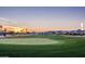 A scenic view of the lush green golf course and surrounding community, is perfect for golfers and nature lovers at 16077 W Vale Dr, Goodyear, AZ 85395