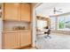 Well-lit home office with built-in desk and ample cabinet space at 16077 W Vale Dr, Goodyear, AZ 85395