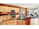 Kitchen showcasing updated stainless steel appliances, granite countertops, and plenty of storage space at 16077 W Vale Dr, Goodyear, AZ 85395