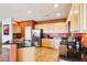 Bright kitchen with stainless steel appliances and black granite countertops, plus plenty of cabinet storage at 16077 W Vale Dr, Goodyear, AZ 85395
