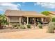 Outdoor living with a covered patio, seating, and desert plants, perfect for enjoying the Arizona weather at 16077 W Vale Dr, Goodyear, AZ 85395